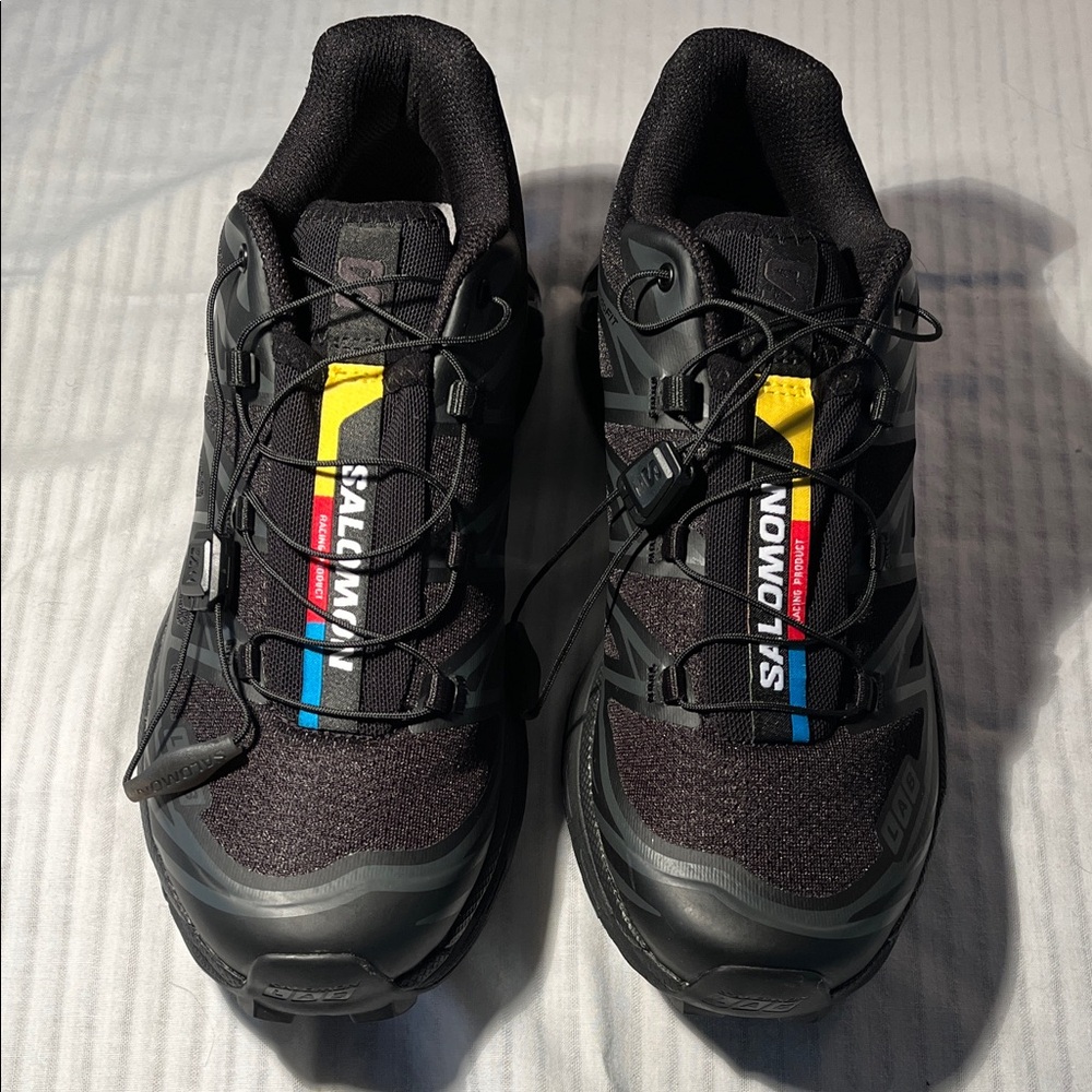 Salomon Black Athletic Shoes with Yellow and Blue Stripes